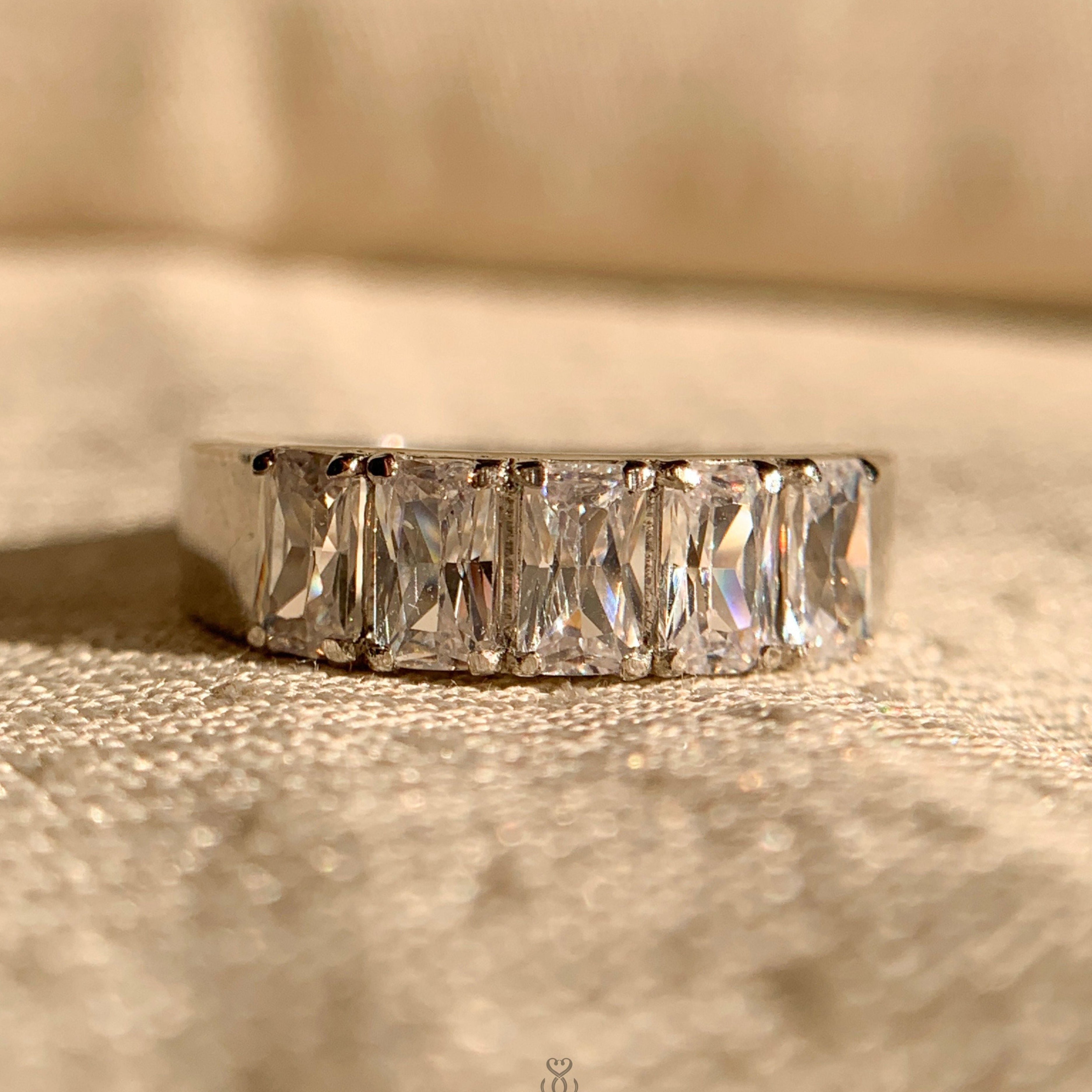 "Emerald shaped diamond wedding band in white gold for women"